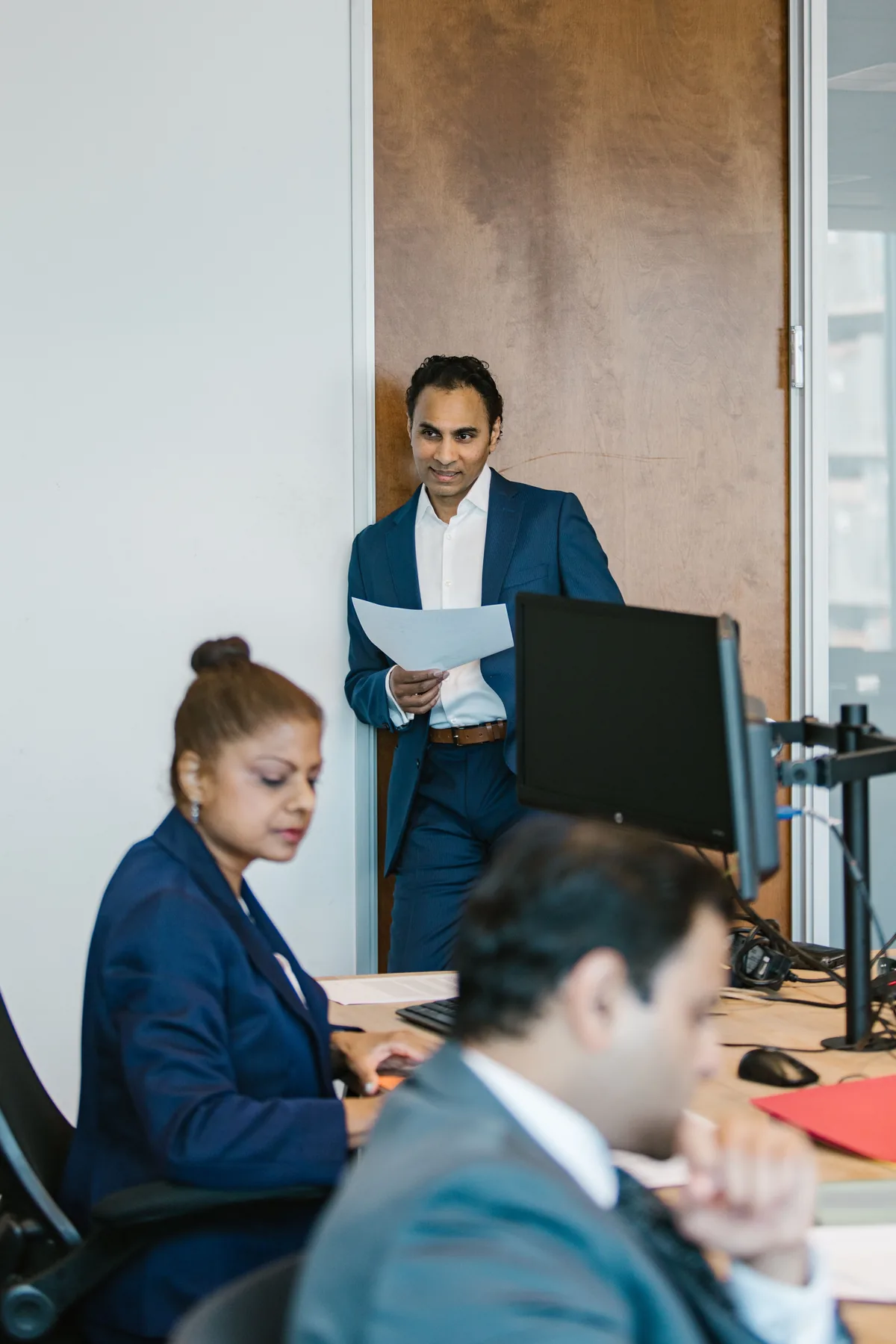 Business professionals working in a formal office